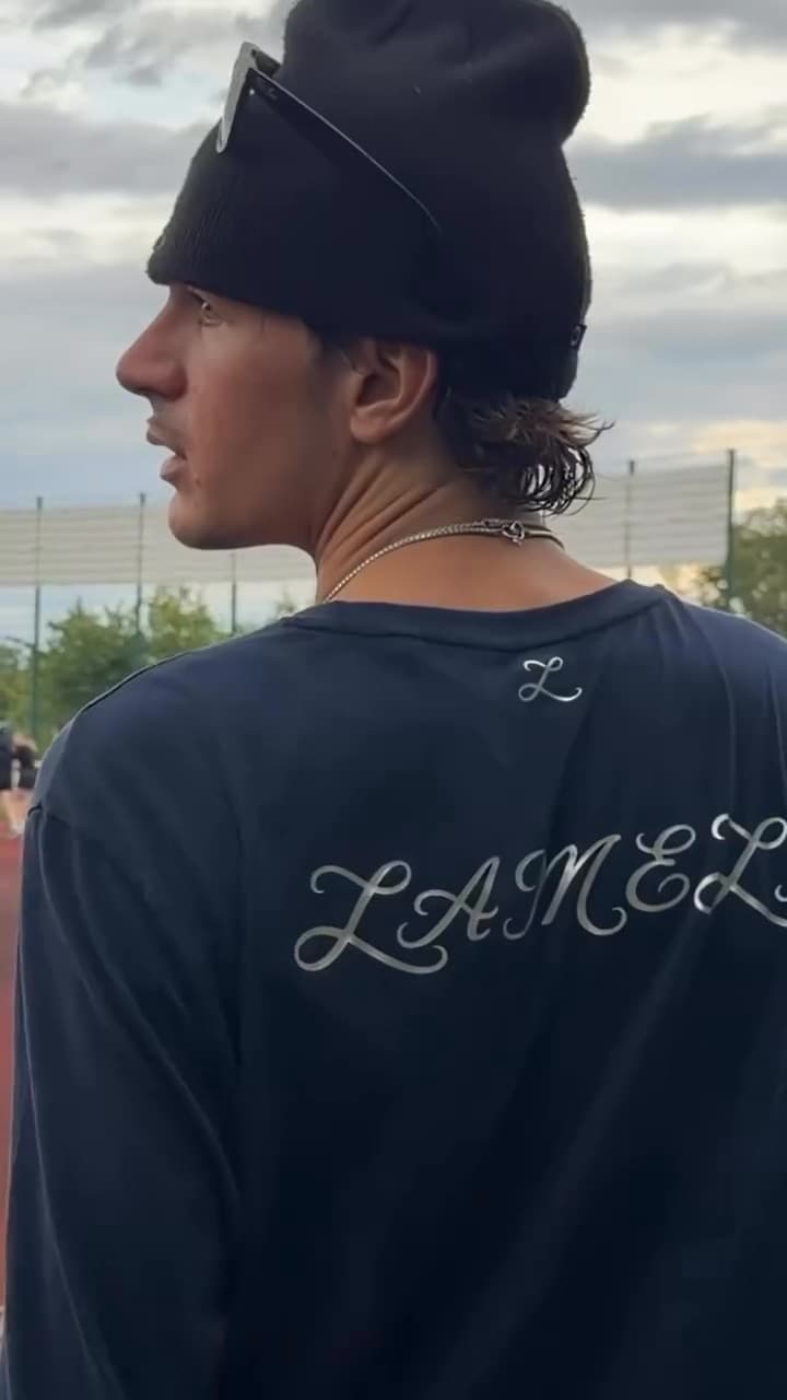 The Lameli lettering on the back of the charity run shirt