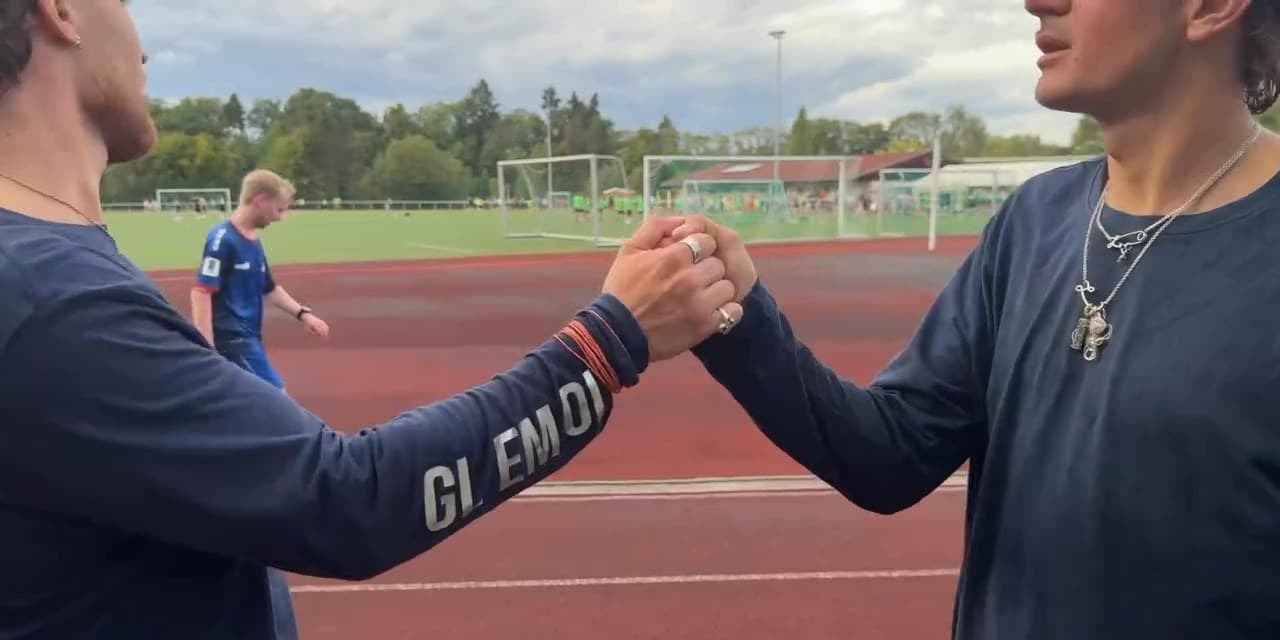 Leon Lameli and GLEMOL shaking hands at the charity run